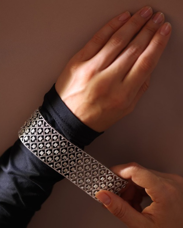 Woven cuff bracelet on wrist
